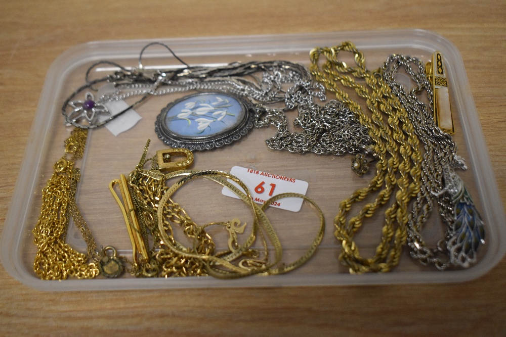 An assortment of costume jewellery including an enamelled and marcasite set peacock brooch, a set of