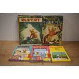 Eleven vintage Rupert Annuals ranging throughout the 1970's and three smaller Rupert books.