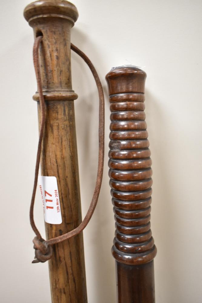 A Victorian hardwood truncheon with turned grip, measuring 46cm long, and another with string grip - Image 2 of 2