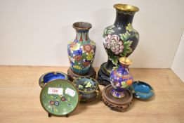 An assorted collection of 19th/20th Century Chinese Cloisonne ware, to include vases on stands and