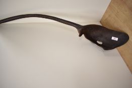 A large African ethnic carved spoon or ladle, measuring 85cm long