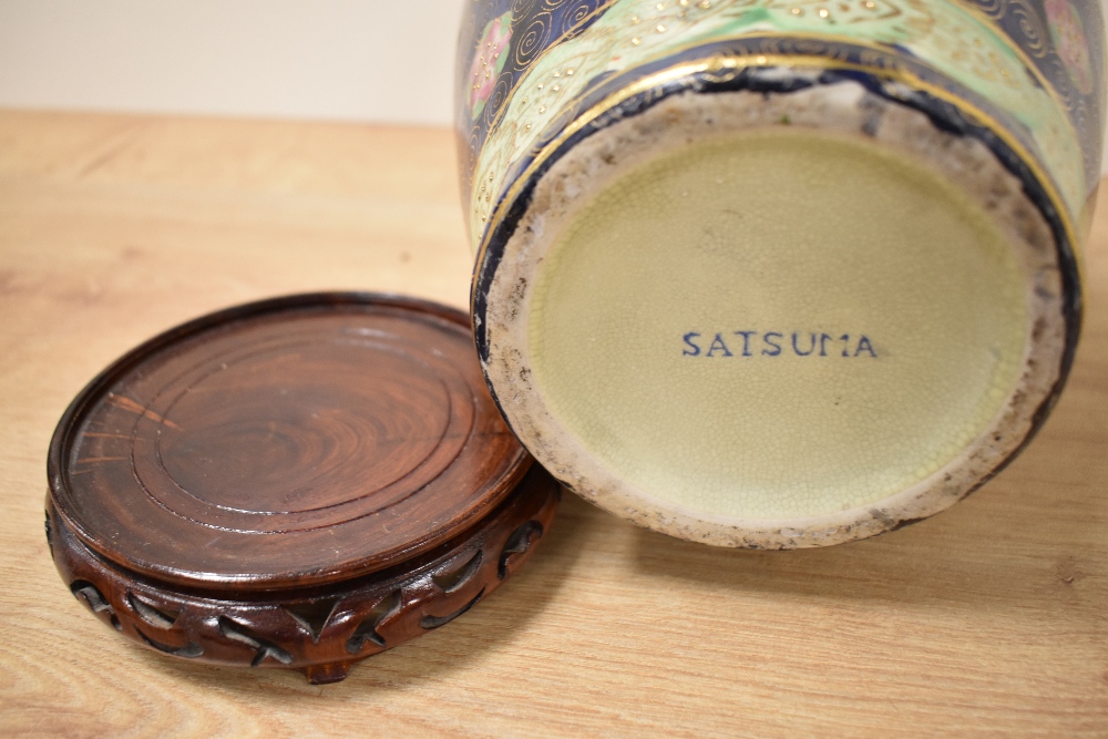 A 20th century eastern pottery baluster vase, in the Satsuma style, marked 'Satsuma' to base, on a - Image 3 of 3