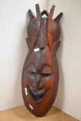 A large African carved hardwood tribal mask, measuring 66cm tall