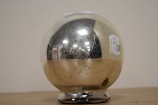 A vintage witch gazing glass ball, of occult interest.