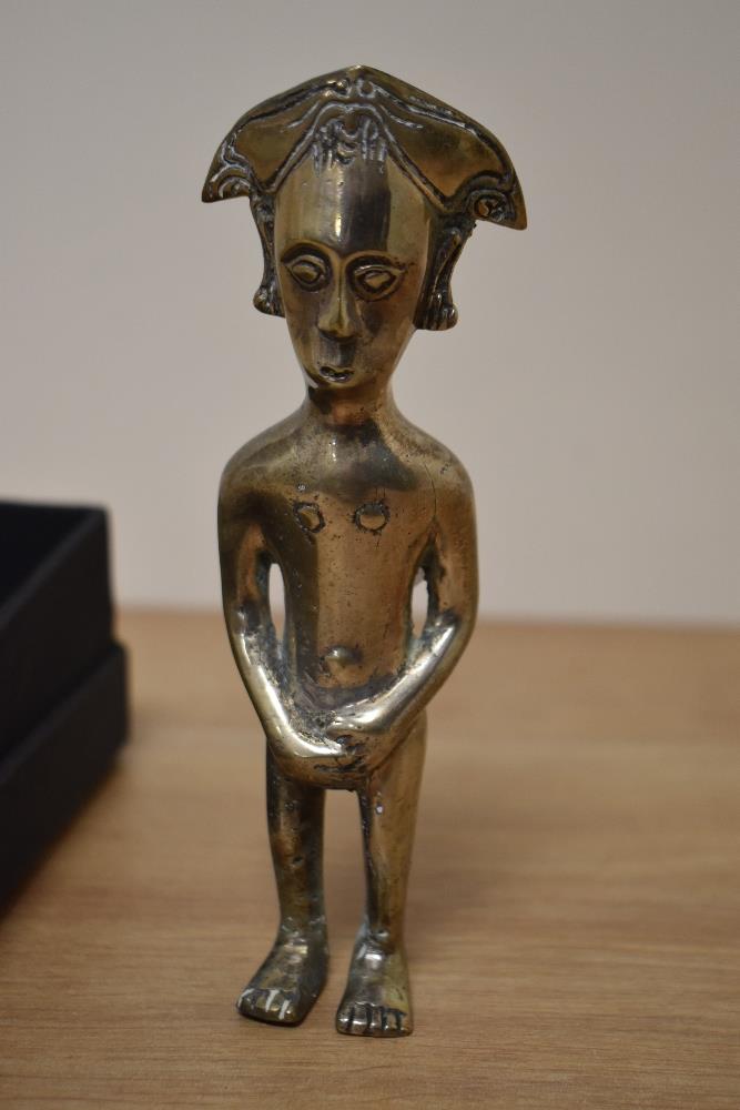 A North African cast metal statue of a male covering his genitals. 16cm high.