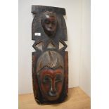 An African carved wooden totem mask.
