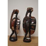 Two 20th century African carved and painted wood guardian birds, possibly Baga, largest being 46cm