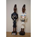Two 20th Century African painted studies of policemen, each measuring 30cm tall (2)