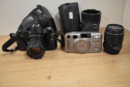 A Pentax MV camera with 1:2 50mm lens, a SMC Pentax-M 1:3:5 135mm lens and Fugifilm 300 zoom Fotonex