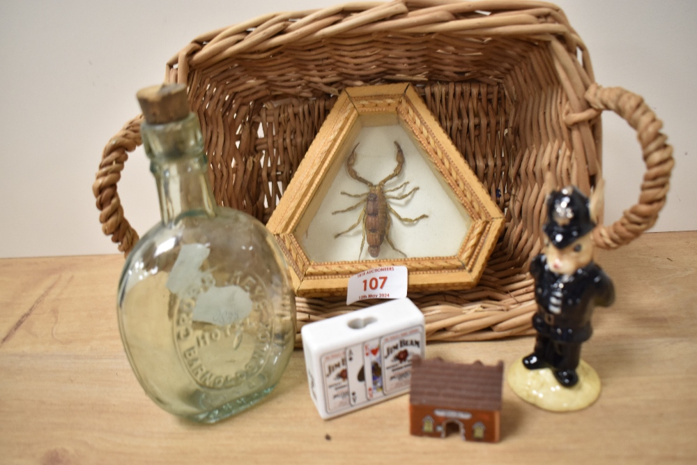 A taxidermy scorpion in triangular carved wood box, a vintage Cross Keys Hotel glass bottle, a Royal