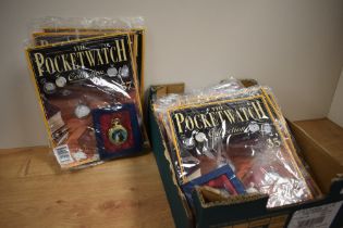 An assortment of The Pocket Watch Collection magazines each with a pocket watch, including '