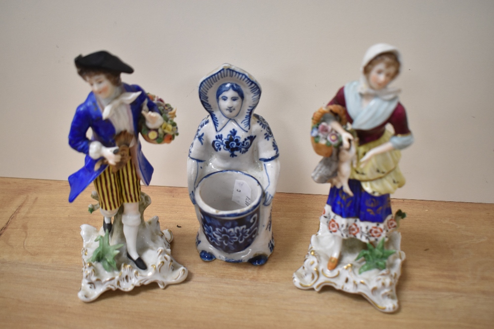 Two 19th Century Continental porcelain figural studies of street sellers, the largest measuring 20cm