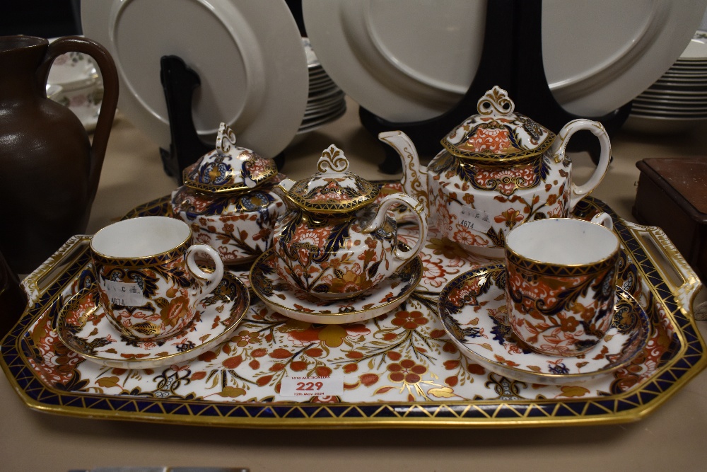 A Victorian Crown Derby porcelain nine piece breakfast set to include canted rectangular tray with