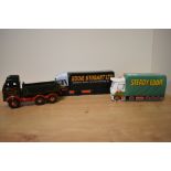 A Wade porcelain Eddie Stobart collector's money bank, measuring 20cm long, together with two