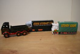 A Wade porcelain Eddie Stobart collector's money bank, measuring 20cm long, together with two