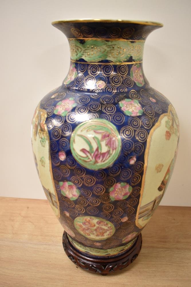 A 20th century eastern pottery baluster vase, in the Satsuma style, marked 'Satsuma' to base, on a - Image 2 of 3