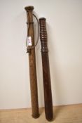 A Victorian hardwood truncheon with turned grip, measuring 46cm long, and another with string grip