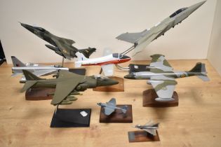 An assorted collection of kit built and other model aircraft on stands, the largest measures 40cm