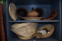 Two African or Oceanic circular woven trays, with Mother of Pearl inlay, measuring 28cm in diameter,