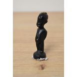 An English cast bronze figure of an African child, gilt embellishment to lips, belly button and