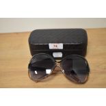 A cased pair of Balenciaga Edition fashion sunglasses with case