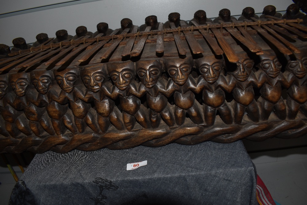 An African carved hardwood plucked idiophone musical instrument profusely carved with repeating - Image 2 of 2