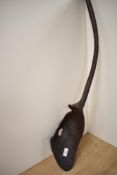 A large African ethnic carved spoon or ladle, measuring 85cm long