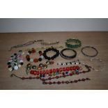 An assortment of costume bracelets including beaded examples, cuff bracelets and bangles etc.