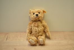 A modern Steiff Teddy Bear, 66612 having growling mechanism with button, yellow tag and original