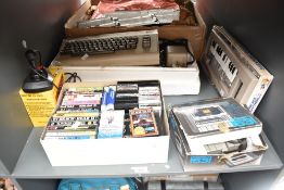 A Commodore C64 Computer, Music Maker, Tape Deck, Joystick and Games including Beach Head II, Off