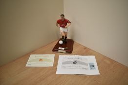 A 2003 Danbury Mint Hand Painted Figure, Roy Keane, on wooden plinth with football and
