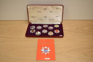 A cased set of Limited Edition London Fire Brigade Historic Badges, 10 in the set, with booklet, Set