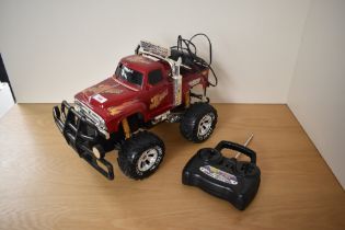 A Turbo Tec Radio Controlled Mad Bull 4x4 Off Road Truck, with controller and cables