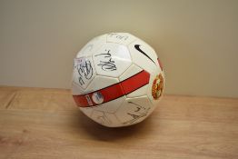 A Manchester United Football bearing signatures from players at the time