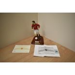 A 2003 Danbury Mint Hand Painted Figure, Ruud Van Nistelrooy, on wooden plinth with football and