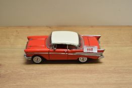 A 1992 Franklin Mint 1:24 scale Die-cast, 1957 Chevrolet Belair with tag and certificates, in card