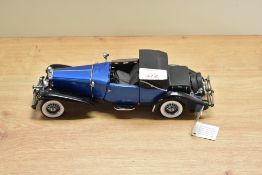 A 1991 Franklin Mint 1:24 scale Die-cast, 1933 Duesenberg J Victoria with tag and certificates, in
