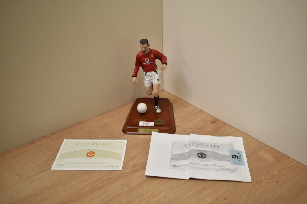 A 2003 Danbury Mint Hand Painted Figure, Ryan Giggs, on wooden plinth with football and certificate,