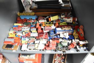 A shelf of playworn Die-casts including Dinky, Corgi, Matchbox etc