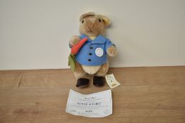 A modern Steiff Bear, 660481 Peter Rabbit with yellow tag and button, in pull string bag