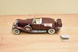 A Franklin Mint 1:24 scale Die-cast, 1935 Duesenberg J550 with tag and certificates, in card box
