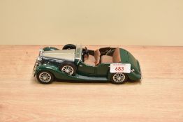 A 1989 Franklin Mint 1:24 scale Die-cast, 1938 Alvis 4.3 Litre with tag and certificates, in card