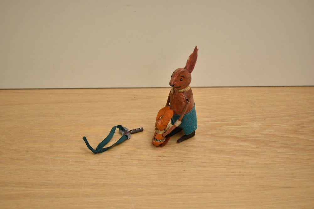 A Schuco cloth covered tinplate & clockwork figure of an acrobatic Kangaroo and Joey, key present