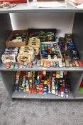 Two shelves of mainly playworn Die-casts including Corgi, Burago, Matchbox, etc along with a small