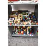 Two shelves of mainly playworn Die-casts including Corgi, Burago, Matchbox, etc along with a small