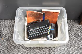 A Sinclair ZX Spectrum 48K with cables and instruction booklets