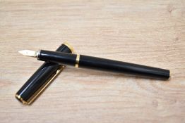A Platinum PTL-5000 converter fill fountain pen in black with gold trim having 14K P nib
