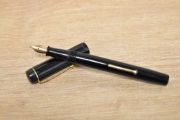 A Pitmans Fono lever fill fountain pen in black having Warrented 14CT 1st Quality nib