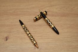 Aboxed UNIC ladies pump fill fountain and ballpoint pen set with ornate 18ct gold filigree and