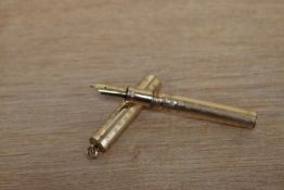 A Wahl lever fill ring top fountain pen in gold fill with Greek key design having Wahl 2 14K nib